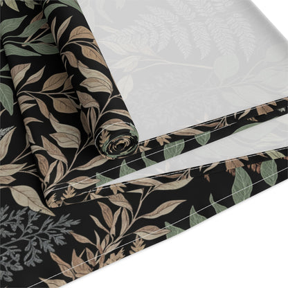 Detailed view of botanical fern table runner fabric with folded edge showing leaf pattern. Cotton Twill